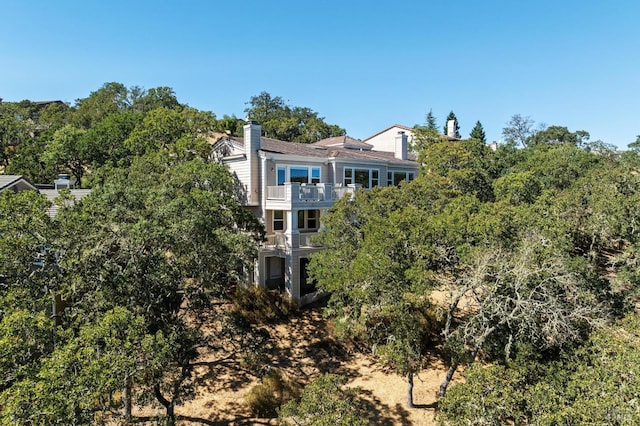 rear view of house with a balcony