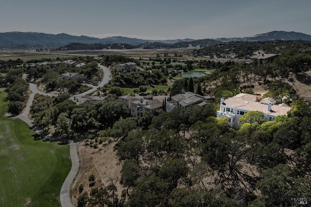 birds eye view of property with a mountain view