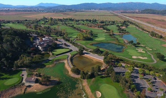 bird's eye view with a water and mountain view