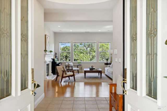 entryway with light tile patterned floors