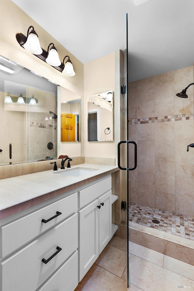 full bath featuring a stall shower and vanity