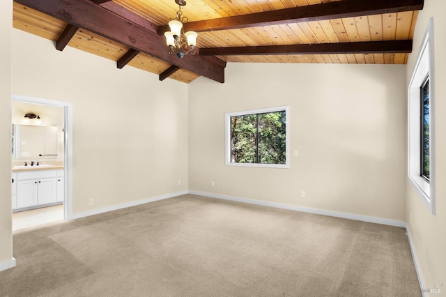 carpeted spare room with wood ceiling, a healthy amount of sunlight, vaulted ceiling with beams, and an inviting chandelier