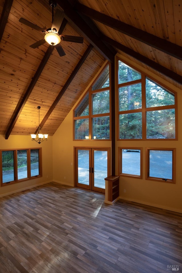 unfurnished living room featuring dark wood-style floors, plenty of natural light, and beam ceiling