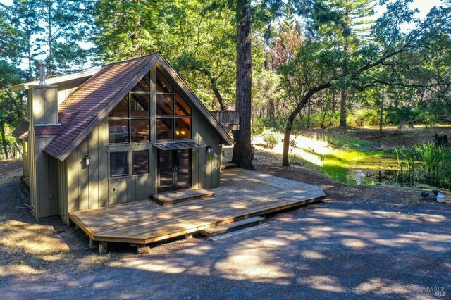 rear view of house with a deck