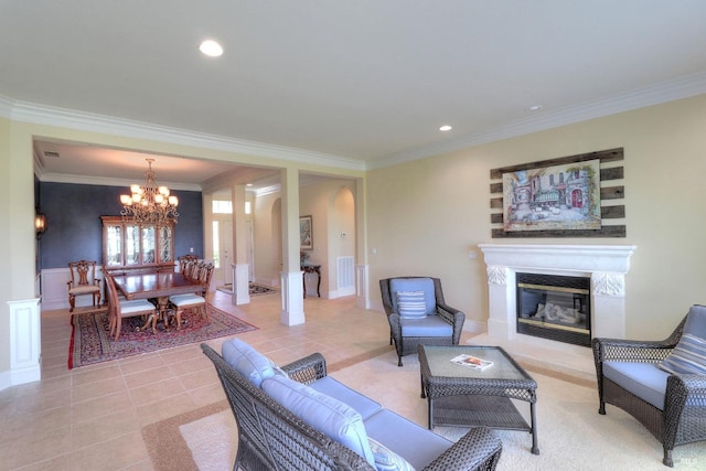 tiled living room with an inviting chandelier and crown molding