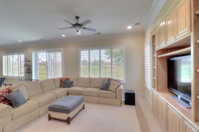 carpeted living room featuring ceiling fan and ornamental molding