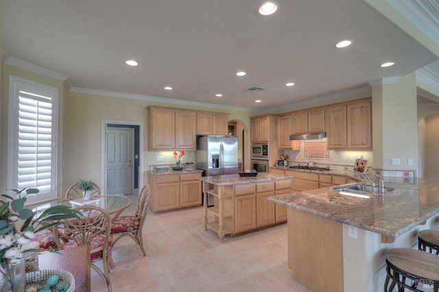 kitchen featuring a kitchen breakfast bar, stainless steel appliances, light stone countertops, light brown cabinetry, and kitchen peninsula