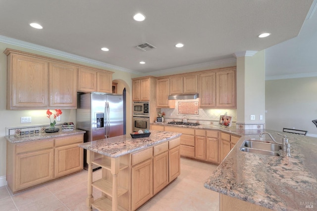 kitchen with appliances with stainless steel finishes, sink, kitchen peninsula, crown molding, and light brown cabinets