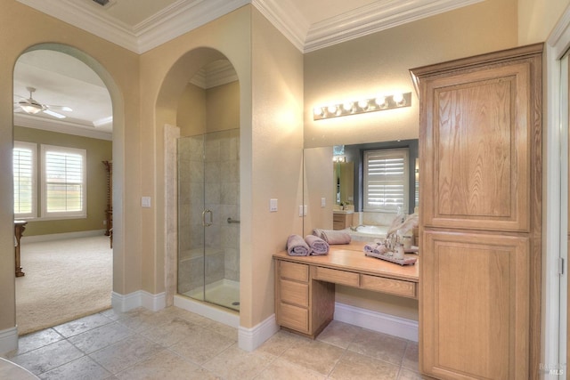 bathroom featuring ceiling fan, an enclosed shower, vanity, ornamental molding, and tile patterned floors