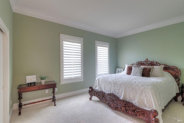 carpeted bedroom featuring ornamental molding