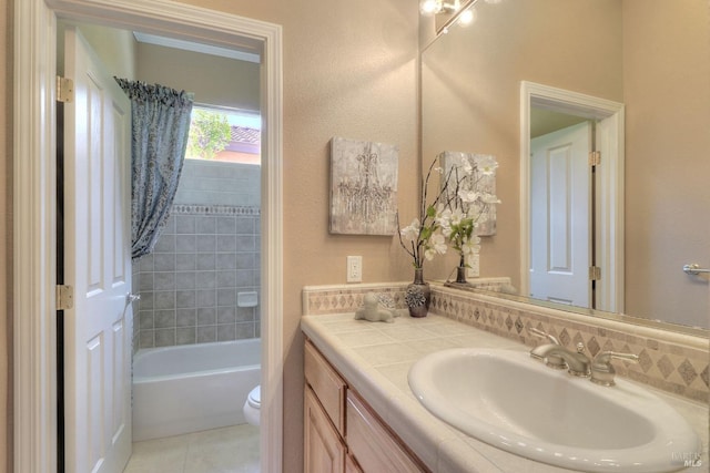 bathroom with tile patterned flooring, vanity, and toilet