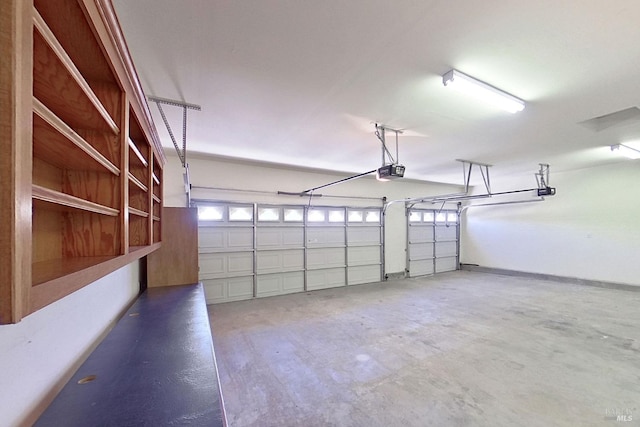 garage featuring a garage door opener