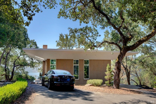 view of front of home featuring a chimney