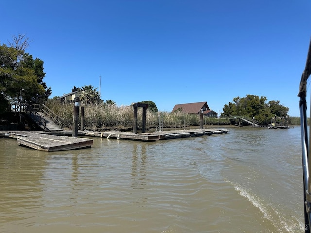 dock area with a water view