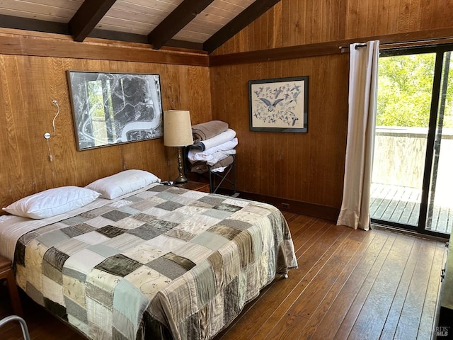 bedroom featuring wooden ceiling, hardwood / wood-style floors, lofted ceiling with beams, wood walls, and access to exterior