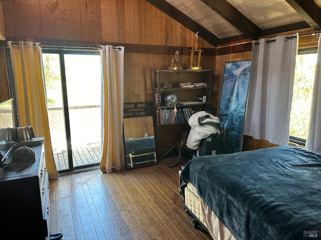 bedroom with hardwood / wood-style floors, access to outside, lofted ceiling with beams, wood walls, and wood ceiling