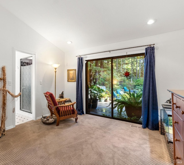 sitting room featuring light carpet, visible vents, vaulted ceiling, and recessed lighting