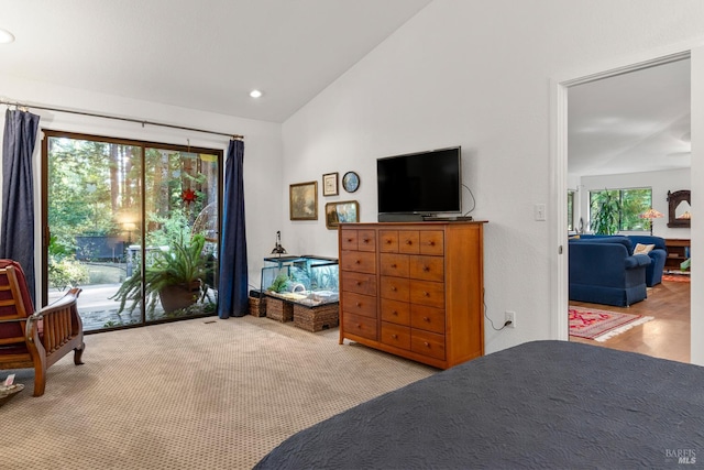 bedroom featuring access to outside, light colored carpet, vaulted ceiling, and recessed lighting