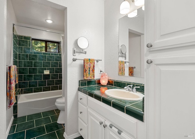 bathroom featuring shower / tub combination, vanity, toilet, and tile patterned floors