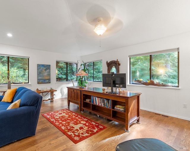 office space featuring light wood-style flooring, visible vents, baseboards, and recessed lighting