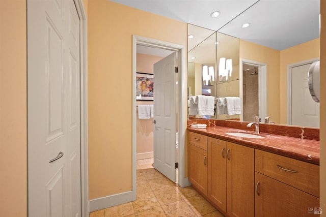 bathroom featuring baseboards, connected bathroom, recessed lighting, vanity, and tile patterned flooring