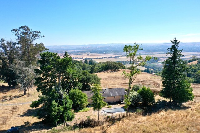 birds eye view of property featuring a rural view