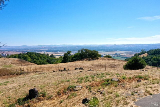 mountain view featuring a rural view