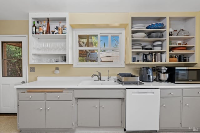 bar with gray cabinets, sink, and white dishwasher