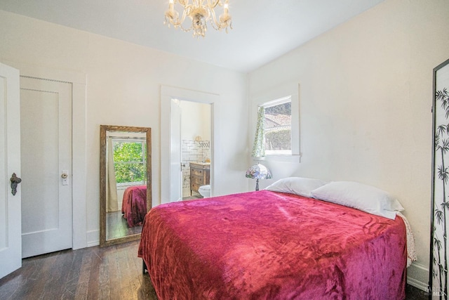 bedroom featuring multiple windows, a chandelier, and dark hardwood / wood-style floors