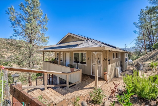 back of property featuring a deck