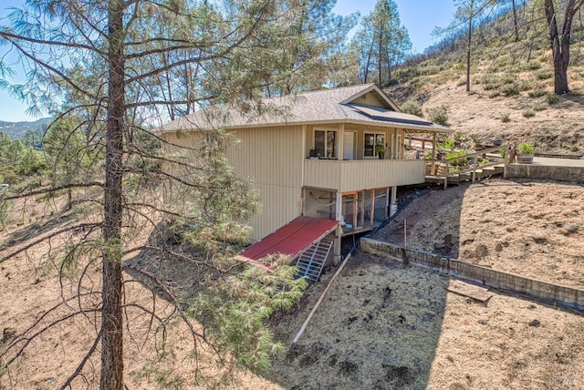 rear view of property with a mountain view