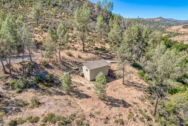 birds eye view of property with a mountain view