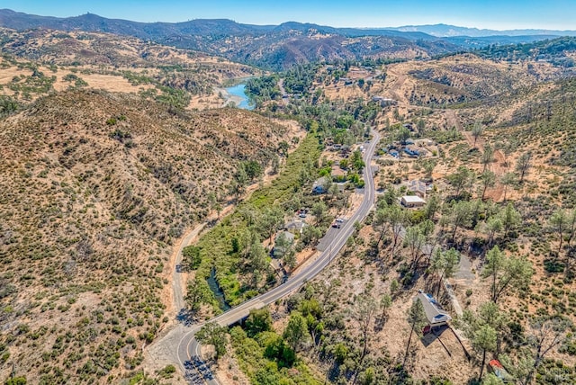 birds eye view of property featuring a water and mountain view