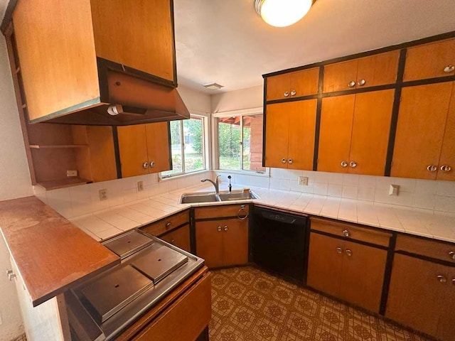 kitchen with dishwasher, stove, sink, tile counters, and extractor fan