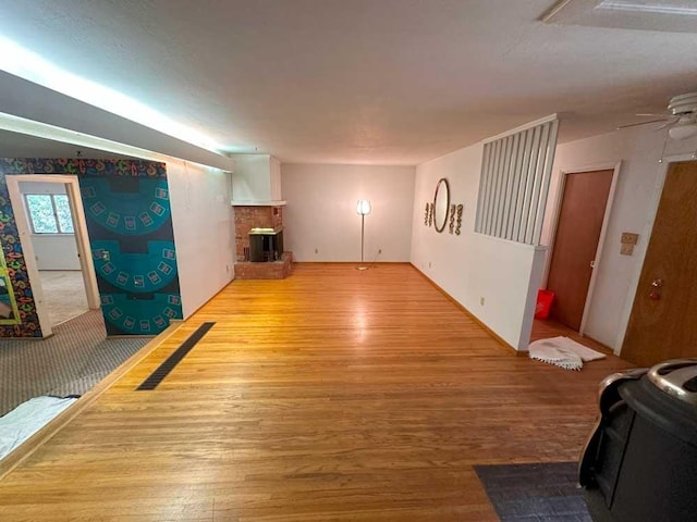 living room featuring light hardwood / wood-style floors and ceiling fan