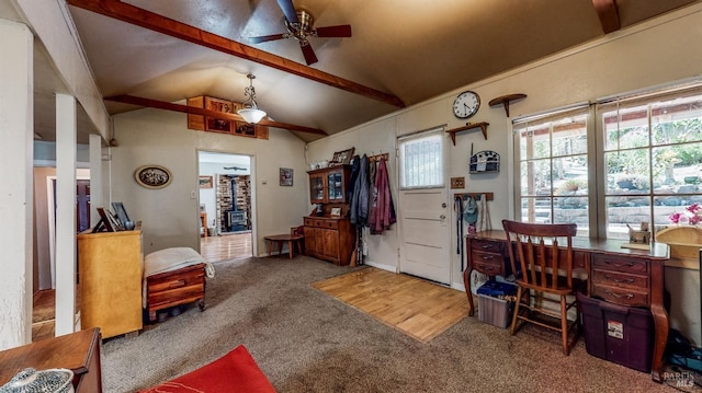 office space with lofted ceiling with beams, carpet, and ceiling fan