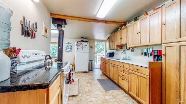kitchen featuring light brown cabinets, lofted ceiling with beams, white appliances, brick patterned floor, and a sink