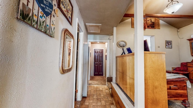 corridor featuring a textured ceiling