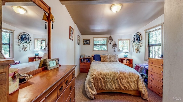 carpeted bedroom featuring lofted ceiling