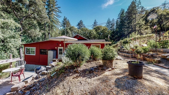 back of house with a patio area