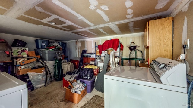 clothes washing area featuring separate washer and dryer