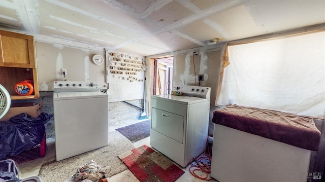 laundry room featuring washing machine and clothes dryer