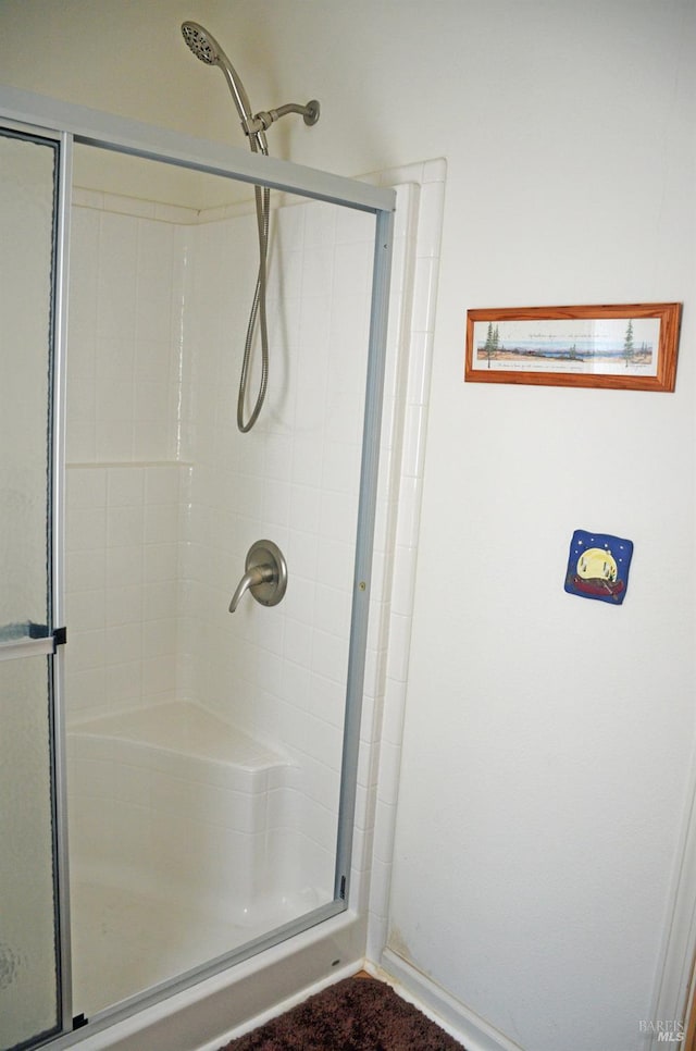 bathroom featuring an enclosed shower