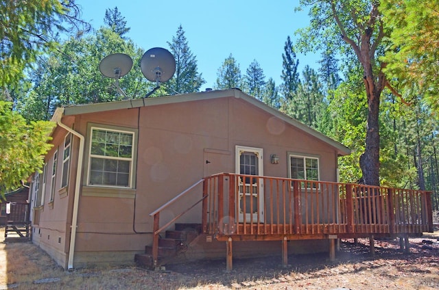 view of front of house with a wooden deck