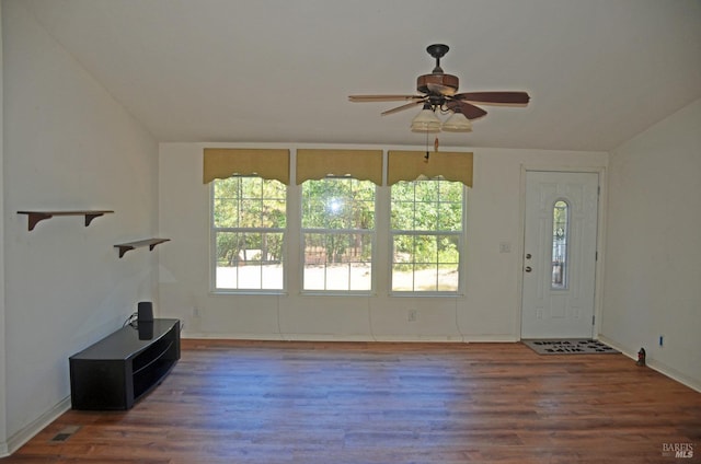 unfurnished living room with hardwood / wood-style floors and ceiling fan