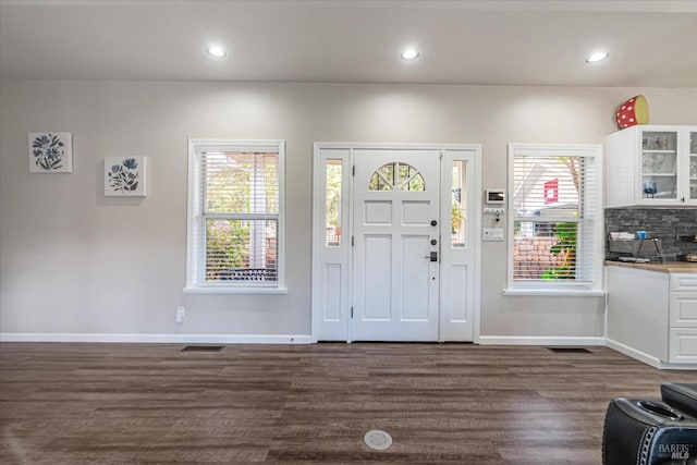 foyer with dark hardwood / wood-style flooring