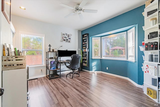 office space with ceiling fan and hardwood / wood-style flooring