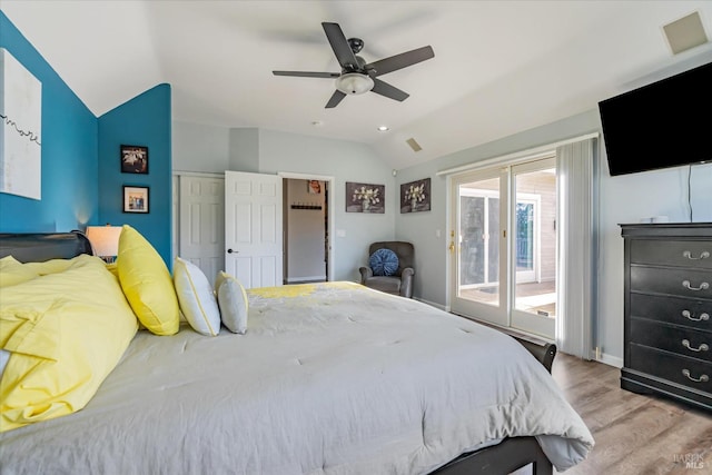 bedroom with a closet, lofted ceiling, access to outside, light hardwood / wood-style flooring, and ceiling fan