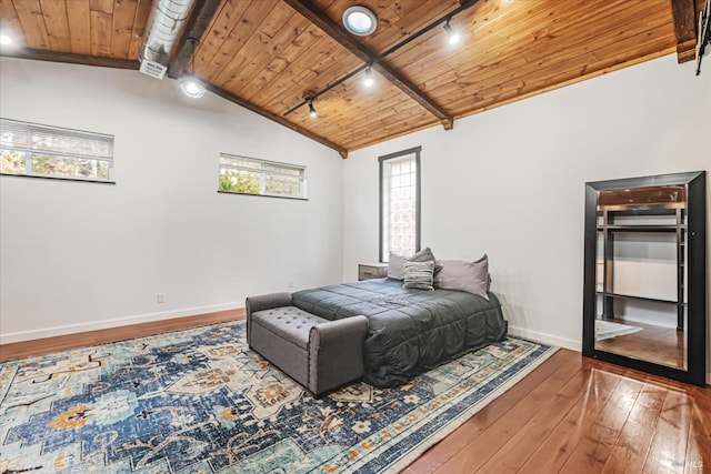 bedroom with multiple windows, wood ceiling, and hardwood / wood-style flooring