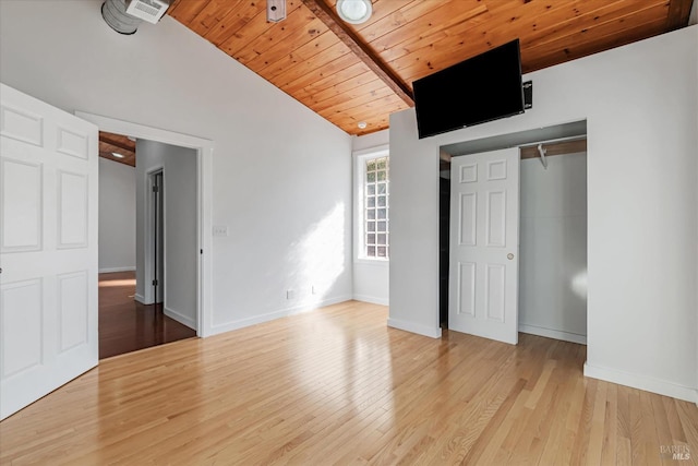 unfurnished bedroom with wood ceiling, lofted ceiling, light hardwood / wood-style flooring, and a closet